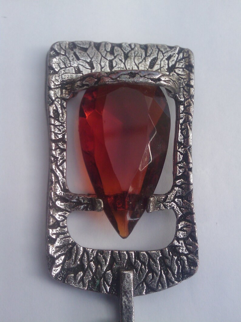 Faceted amber teardrop glass pendant in a pewter setting