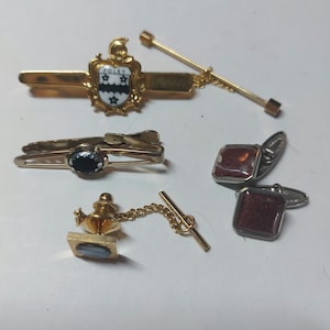 Five  items two tie pins , clip  a collar  stay and cufflinks