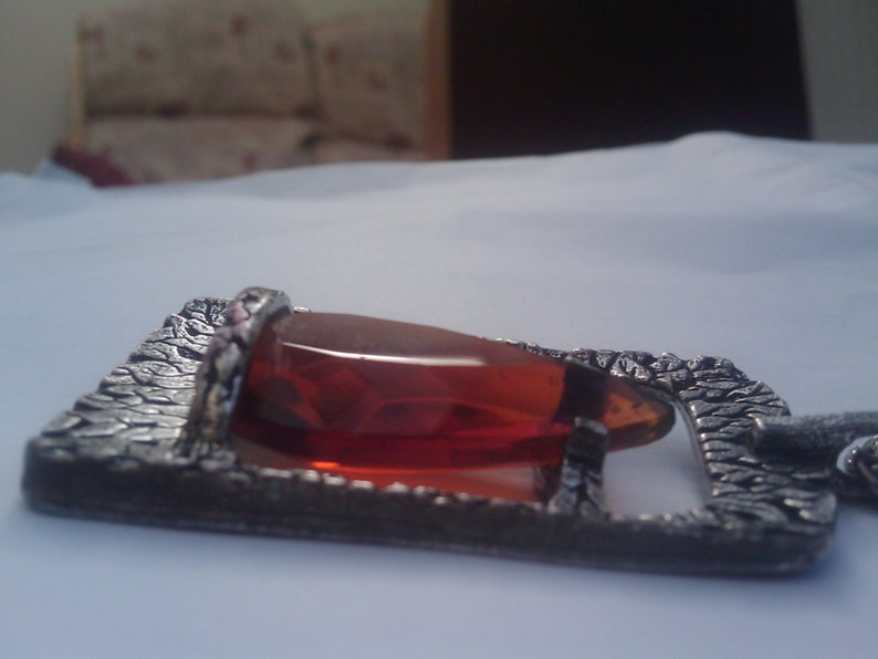 Faceted amber teardrop glass pendant in a pewter setting