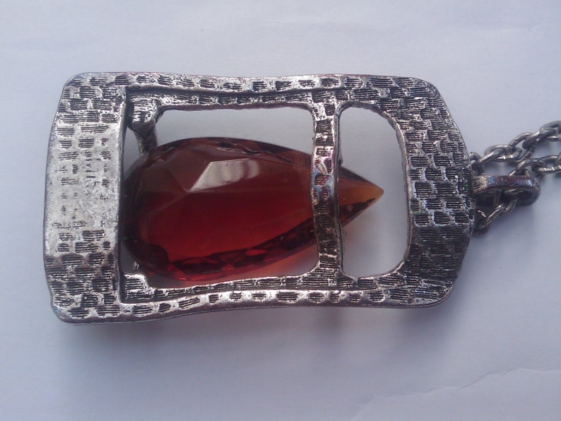 Faceted amber teardrop glass pendant in a pewter setting