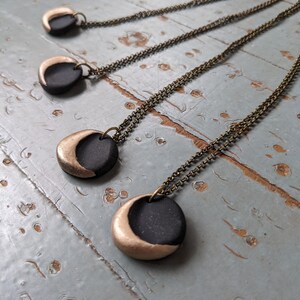 Handmade polymer clay gold and black crescent moon pendant necklace