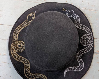 Hand painted upcycled black wool hat with silver and gold snakes