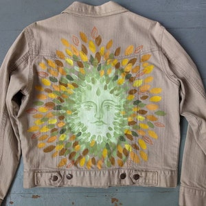 Hand painted original art denim jacket of a green man in fall leaves