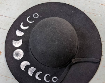 Hand painted upcycled black wool floppy hat with phases of the moon