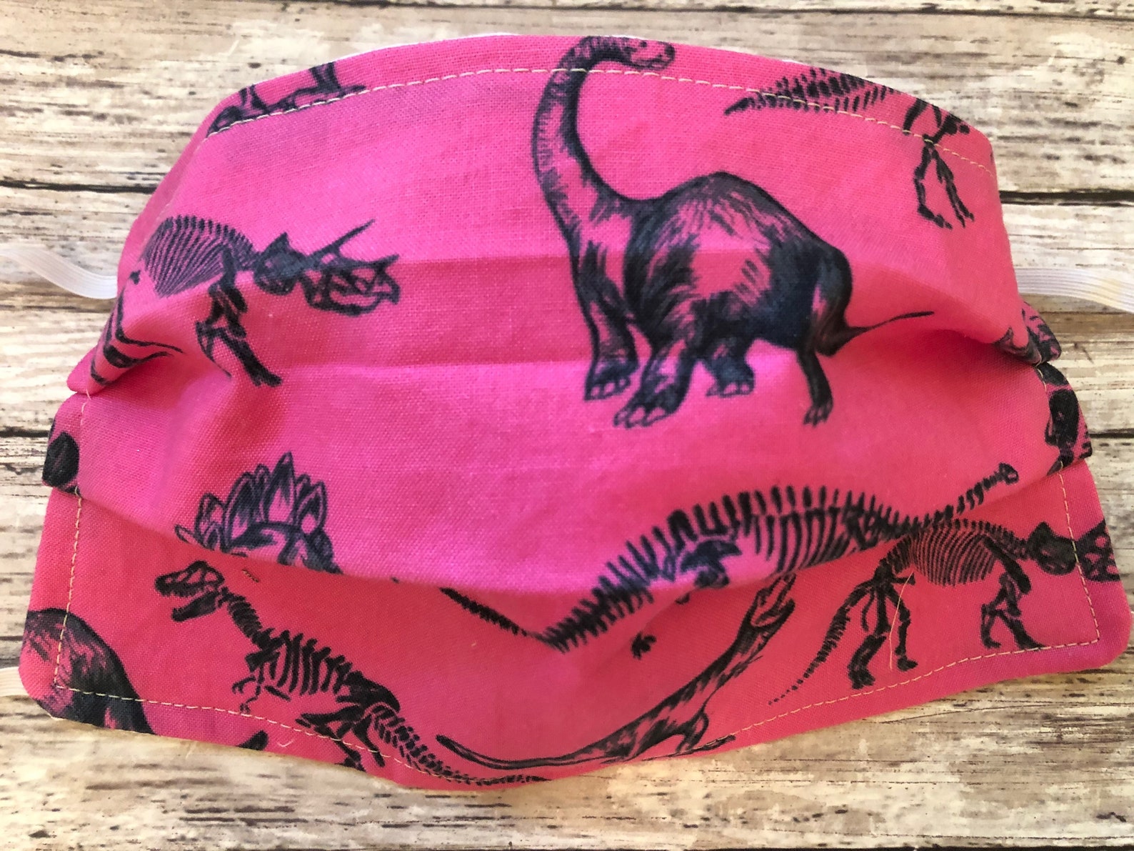pink dinosaur helmet