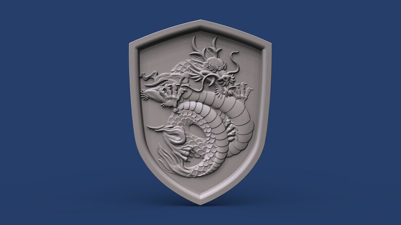 May include: A gray, three-dimensional shield with a detailed carving of a coiled dragon.