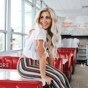 May include: A woman with long blonde hair sits on a red booth in a diner. She is wearing a white crop top and colorful striped pants. The diner has large windows and a sign that says "Welcome Fresh Cooked & Diner".