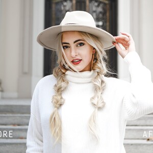 May include: A woman wearing a white sweater and a white hat with a wide brim. Her hair is blonde and styled in two braids. She is standing in front of a white building with a gray staircase.