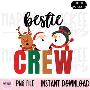 May include: A Christmas-themed graphic design featuring the text "bestie crew" in red, green, brown, and white letters. The design includes a reindeer, Santa Claus, and a snowman.