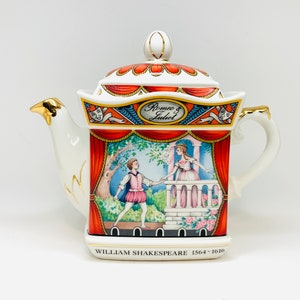 May include: A white porcelain teapot with a red, gold and blue design. The teapot features a scene from Romeo and Juliet with the text "Romeo & Juliet" and "WILLIAM SHAKESPEARE 1564-1616".