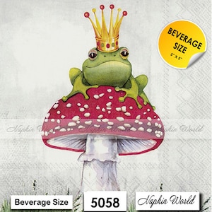 May include: A green frog wearing a gold crown sits on a red and white mushroom with white spots. The mushroom has a white stem. The image is a napkin with the text "Beverage Size 5" x 5" and "Napkin World" printed on it.
