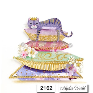 May include: A purple cat wearing a crown sits on a stack of colorful pillows with gold trim. The pillows are decorated with floral patterns and beads. The image includes the text "Napkin World" and "2162".