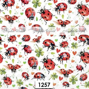 May include: White background with a repeating pattern of red ladybugs, green four-leaf clovers, and pink hearts. The ladybugs are in various positions, some flying, some crawling, and some standing on their legs. The clovers are also in various positions, some with their leaves spread out and some with their leaves folded in. The hearts are scattered randomly throughout the pattern.