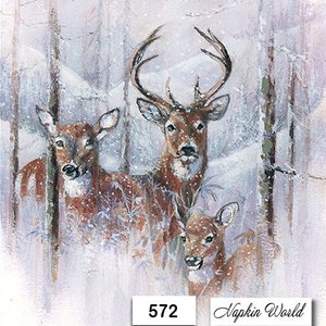 May include: A snowy winter scene with three deer in a forest. The deer are brown and white with large antlers. The background is a soft, muted blue and purple.