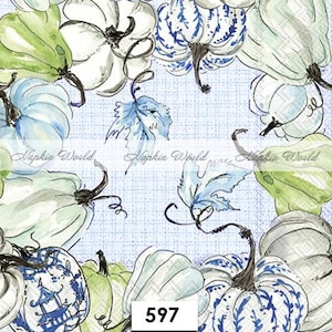 May include: A decorative napkin featuring a watercolor design of pumpkins in shades of white, blue, and green. The pumpkins have dark stems and are arranged on a light blue background. The number "597" is in the lower right corner.