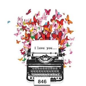 May include: A vintage typewriter with a white paper that reads "I love you..." surrounded by colorful butterflies.