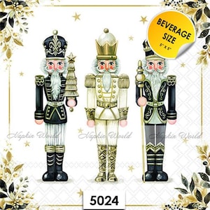 May include: Three decorative nutcracker figures in black, white, and gold, with intricate details. One holds a tree, another a staff. The image includes a sticker that says "BEVERAGE SIZE 5" X 5"" and the number "5024".