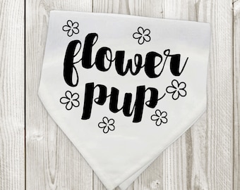 May include: White bandana with black text that says "flower pup" and small flower designs around the text.