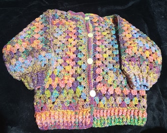 Hand crocheted, toddler or child's cardigan in rainbow tones sized to fit 2 to 4 years old.