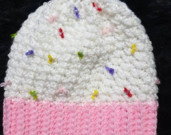 Cute little cupcake style beanies topped with a little red cherry to fit a baby (sized 3 to 12 months).