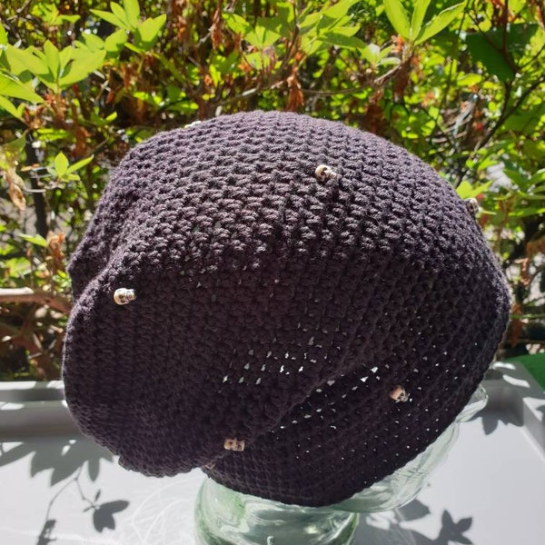 Hand made, unisex, lightweight black slouch hat with skull decorations to fit small to medium size adult.