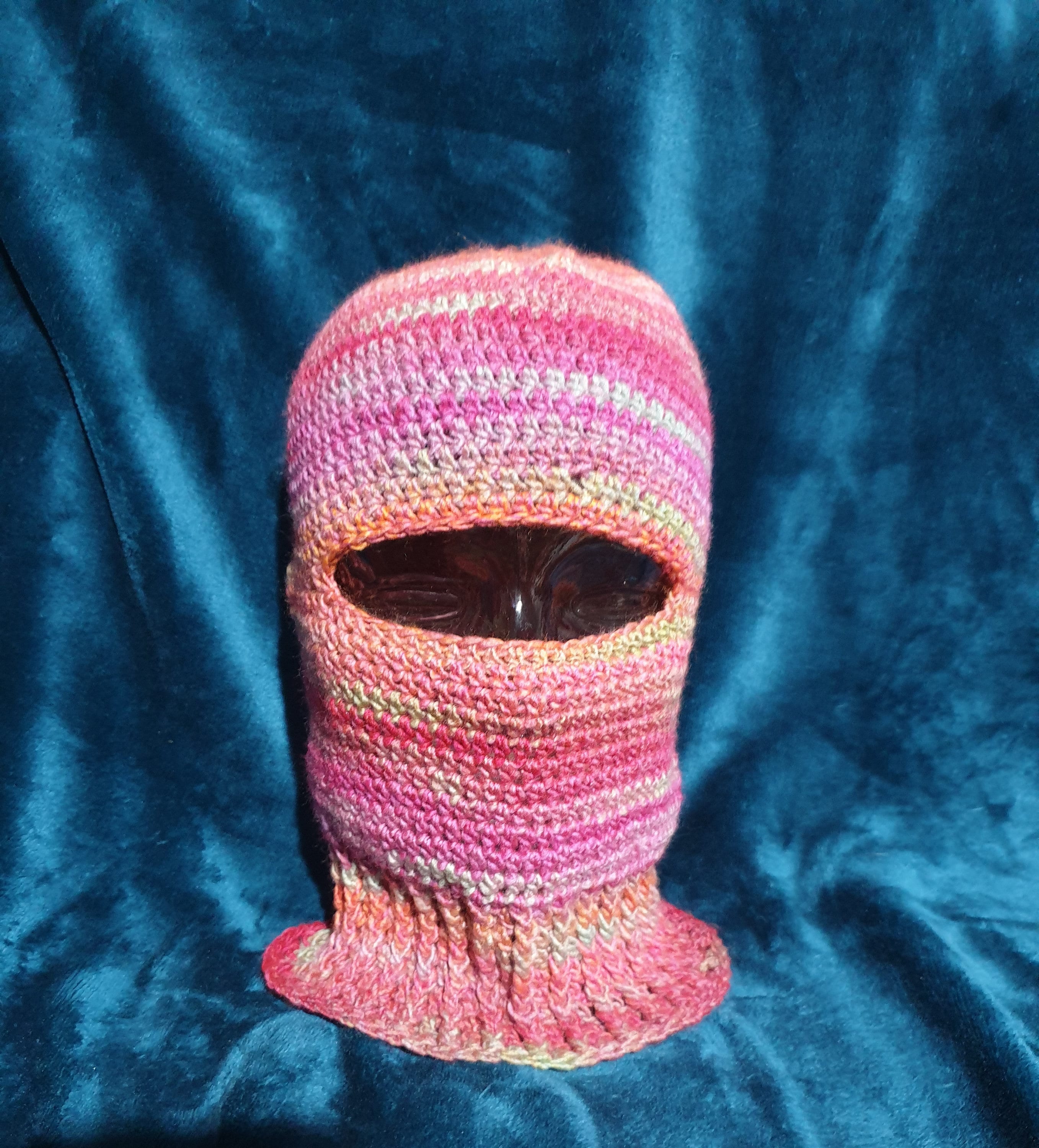 Stylish, unisex, hand crocheted, gorgeous pink rainbow ski mask or balaclava in 100% acrylic sized to fit small to medium adult.