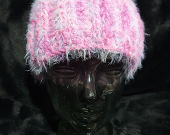 Gorgeously soft, hand crocheted, unisex, fluffy hat in pink and mauve tones sized to fit a medium to large adult.