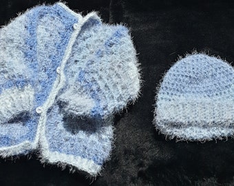 Gorgeously supersoft, variegated blue baby cardigan sized to fit 6 to 18 months with a matching beanie.