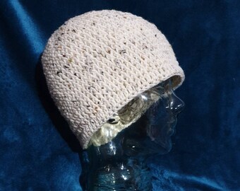 Unisex, woollen beanie sized to fit medium to large adult in beige tweed superwash wool.