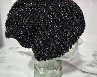 Hand crocheted, black and silver unisex beanie or slouch hat sized to fit a medium to large adult.
