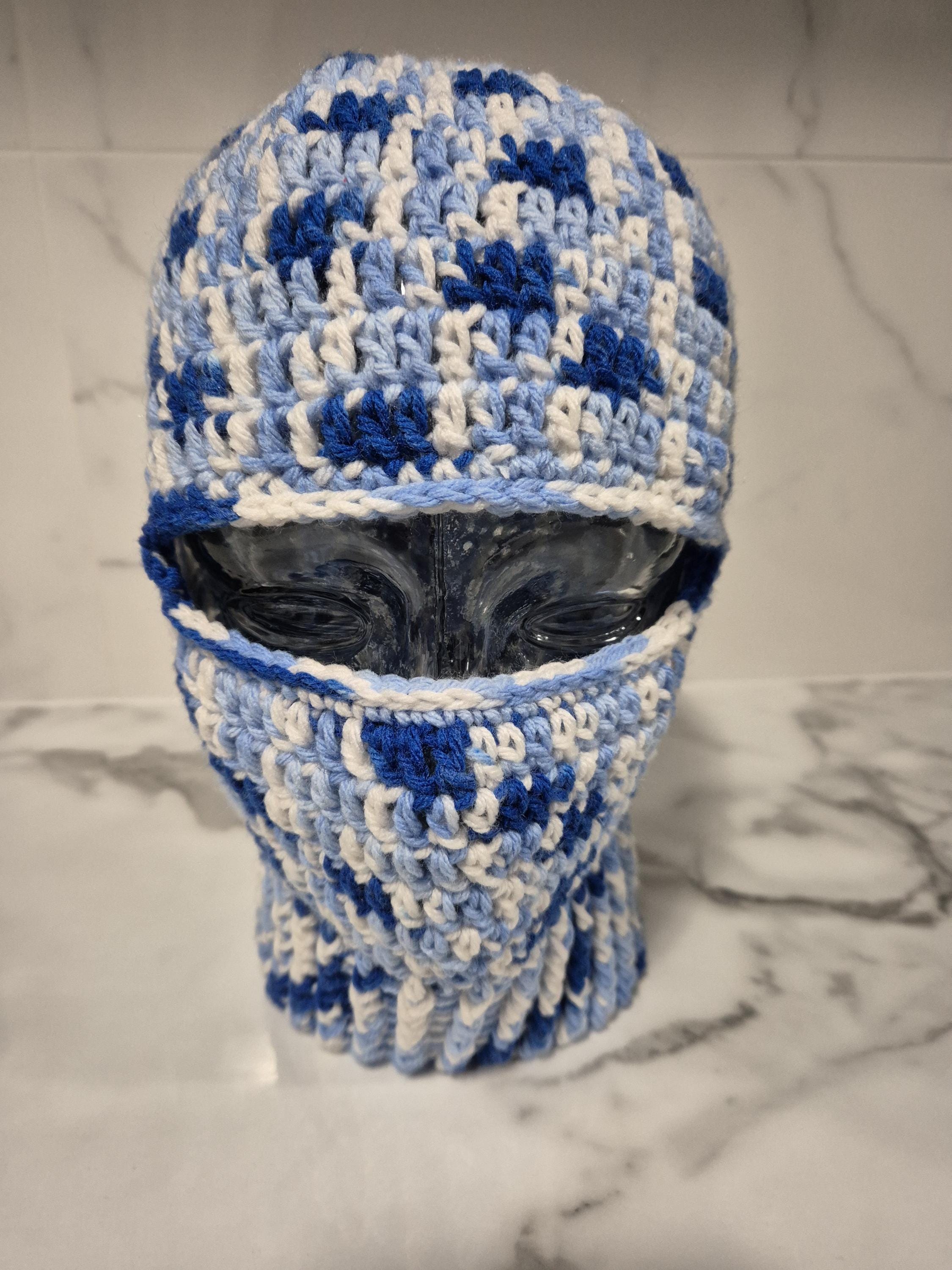 Stylish, unisex, hand crocheted, variegated blue ski mask or balaclava in 100% acrylic sized to fit small to medium adult.