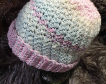 Chunky and soft, small to medium adult size,crochet hat in lovely easy care acrylic yarn in pink, blue, mauve and cream tones.