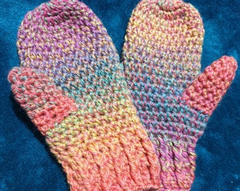 Children's rainbow mittens in 100% wool available in various sizes.