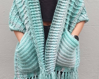 Lovely pale green crochet shawl with pockets and fringe. Wrap with pockets. Fringed pocket shawl.