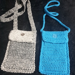 Crochet cotton mobile phone holder with neck strap available in different colours.