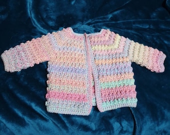 Hand made baby cardigan in pure new wool in gorgeous pastel rainbow tones.