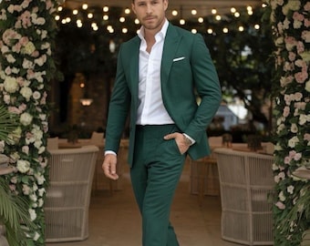 May include: A dark green suit with a white dress shirt. The suit includes a blazer and matching pants. The person is wearing black loafers. The text "Af cloth" is visible at the bottom of the image.