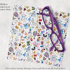 May include: A white microfiber cleaning cloth with a colorful Disney-themed print featuring characters like Mickey Mouse, Stitch, and the Genie. The print includes the text "Best Day Ever" and "Never Grow Up". A purple pair of glasses is lying on top of the cloth.