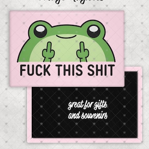 May include: Pink fridge magnet with a green frog graphic giving the middle finger, with the text "FUCK THIS SHIT". A second magnet with the text "great for gifts and souvenirs" is also shown. The words "Fridge Magnets" are at the top.
