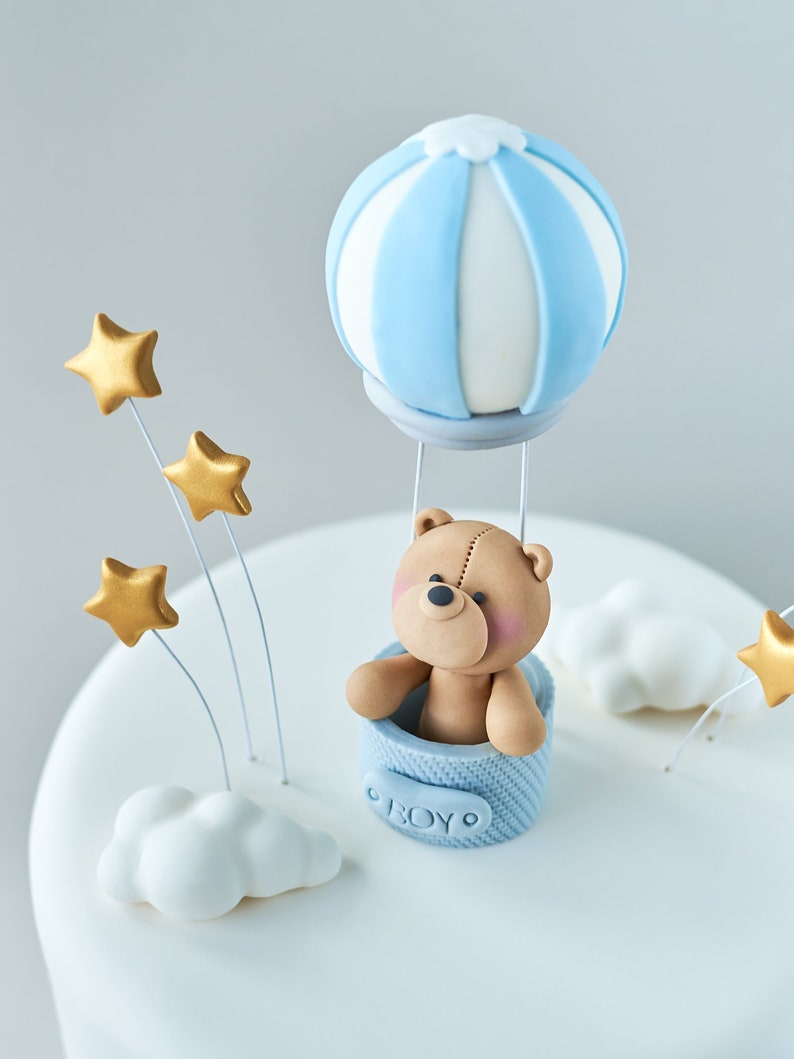 teddy bear with blue balloons