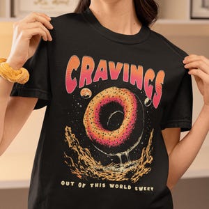 Cosmic Cravings Donuts Graphic T-Shirt | Sweet Dessert Shirt, Unisex Fashion Tee, Perfect for Food Lovers, Gift for Birthdays and Holidays