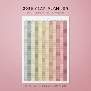 May include: A 2026 year planner with a gradient colour scheme, displaying months and dates. The text "2026 YEAR PLANNER" and "MULTIPLE SIZES | PDF DOWNLOAD" are at the top. The planner is available in multiple sizes, including 91x61 cm and letter size.