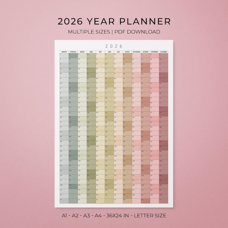 May include: A 2026 year planner with a gradient colour scheme, displaying months and dates. The text "2026 YEAR PLANNER" and "MULTIPLE SIZES | PDF DOWNLOAD" are at the top. The planner is available in multiple sizes, including 91x61 cm and letter size.