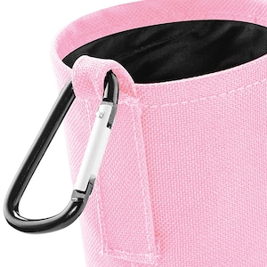 May include: A pink fabric pouch with a black carabiner clip. The pouch has a black lining and a small pocket on the side.
