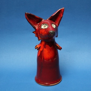 Red fox ceramic figurine. Ceramic sculpture of a fox, an original author&#39;s figure of a fox with red glaze. Animal figures