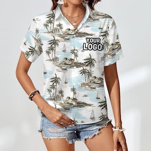 May include: White short-sleeved button-down shirt with a tropical print featuring palm trees, sailboats, and islands. The shirt has a pocket on the left chest with the text "YOUR LOGO" printed in black.