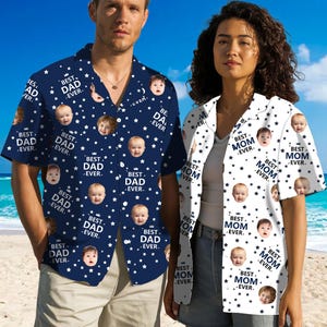 May include: Two matching short-sleeved shirts with a white background and blue stars. One shirt has the text "Best Dad Ever" repeated with a different baby's face in each instance. The other shirt has the text "Best Mom Ever" repeated with a different baby's face in each instance.