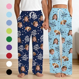 May include: Navy blue pajama pants with a repeating pattern of children's faces, dogs, and the text "Best Dad Ever." Light blue pajama pants with a repeating pattern of children's faces, dogs, and the text "Best Mom Ever."