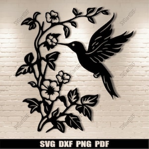 May include: Black silhouette of a hummingbird with outstretched wings, perched on a branch with delicate flowers. The design is perfect for creating a decorative wall art piece.
