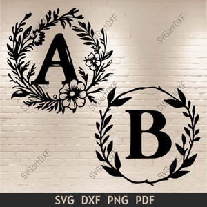 May include: Two black and white floral wreaths with the letters A and B in the center.